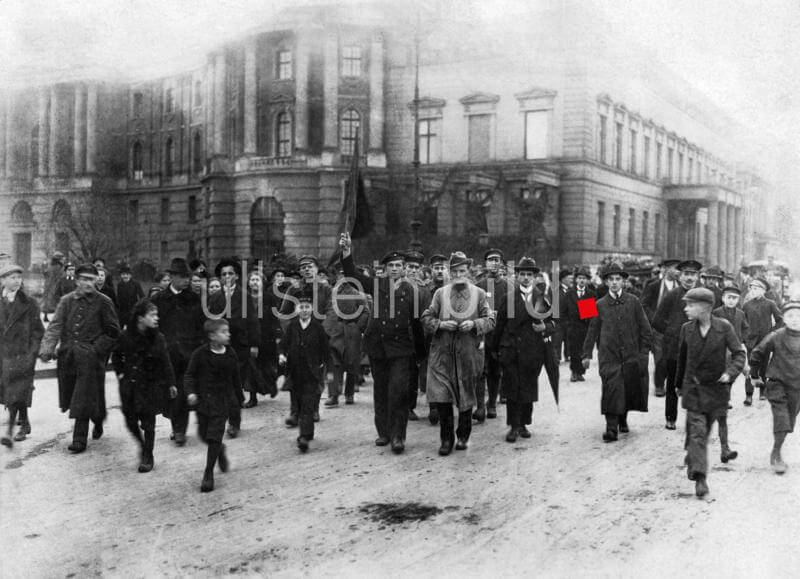 Demonstration on "Unter den Linden" headed by a sailor with a red flag. November 1918