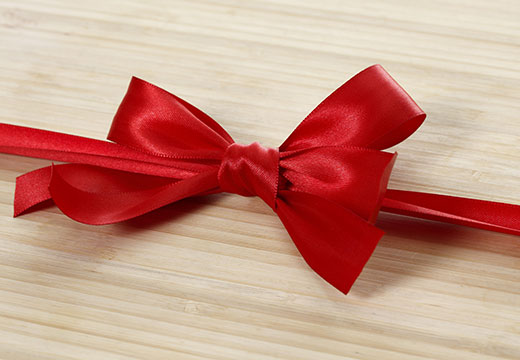 Symbolic photo for Historical Newspapers: red ribbon
